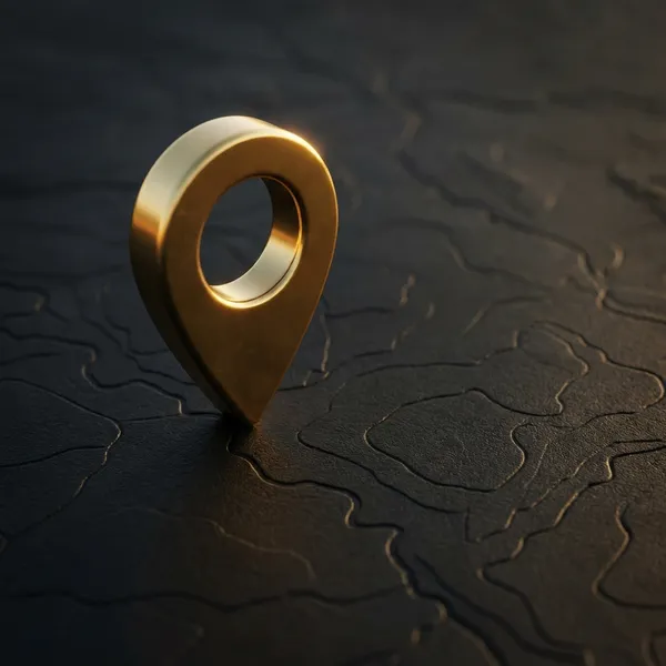 Pin de ubicación dorado sobre mapa oscuro para SEO Local
